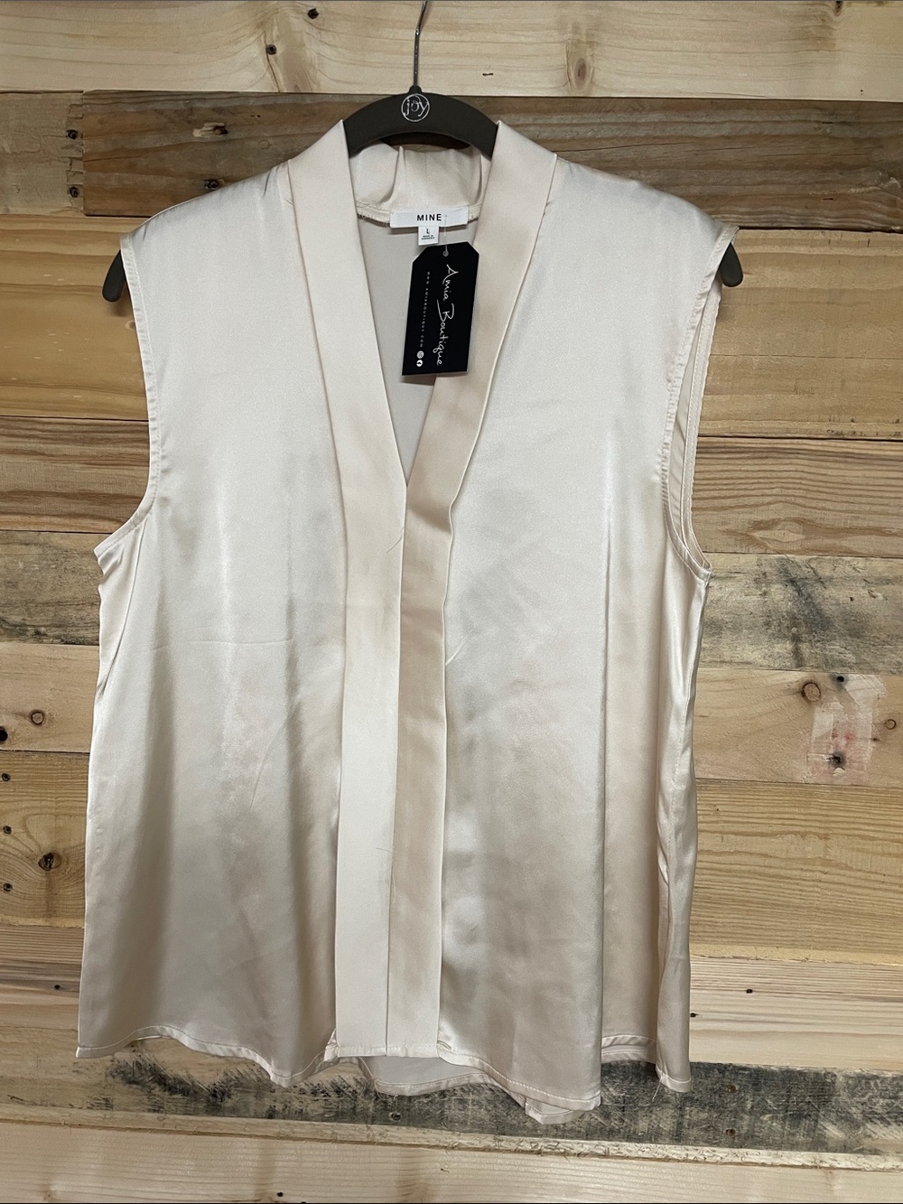 Mine size large ivory color satin v-neck sleeveless blouse